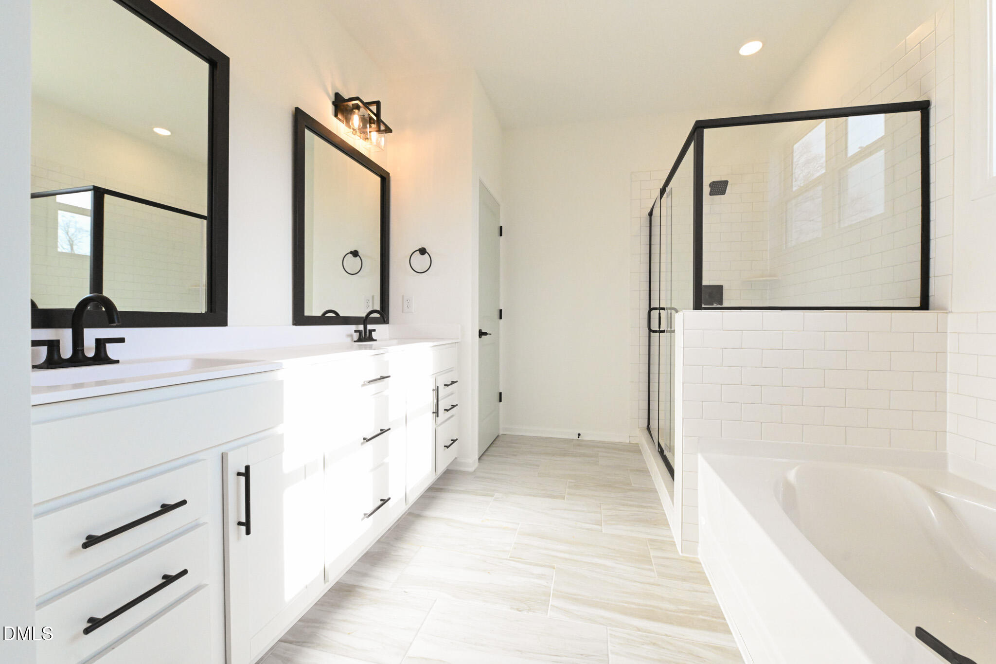 72 South Bream Court Angier, NC 27501 - Photo 28 of 44 a spacious bathroom with a double vanity sink a mirror a shower and a bathtub