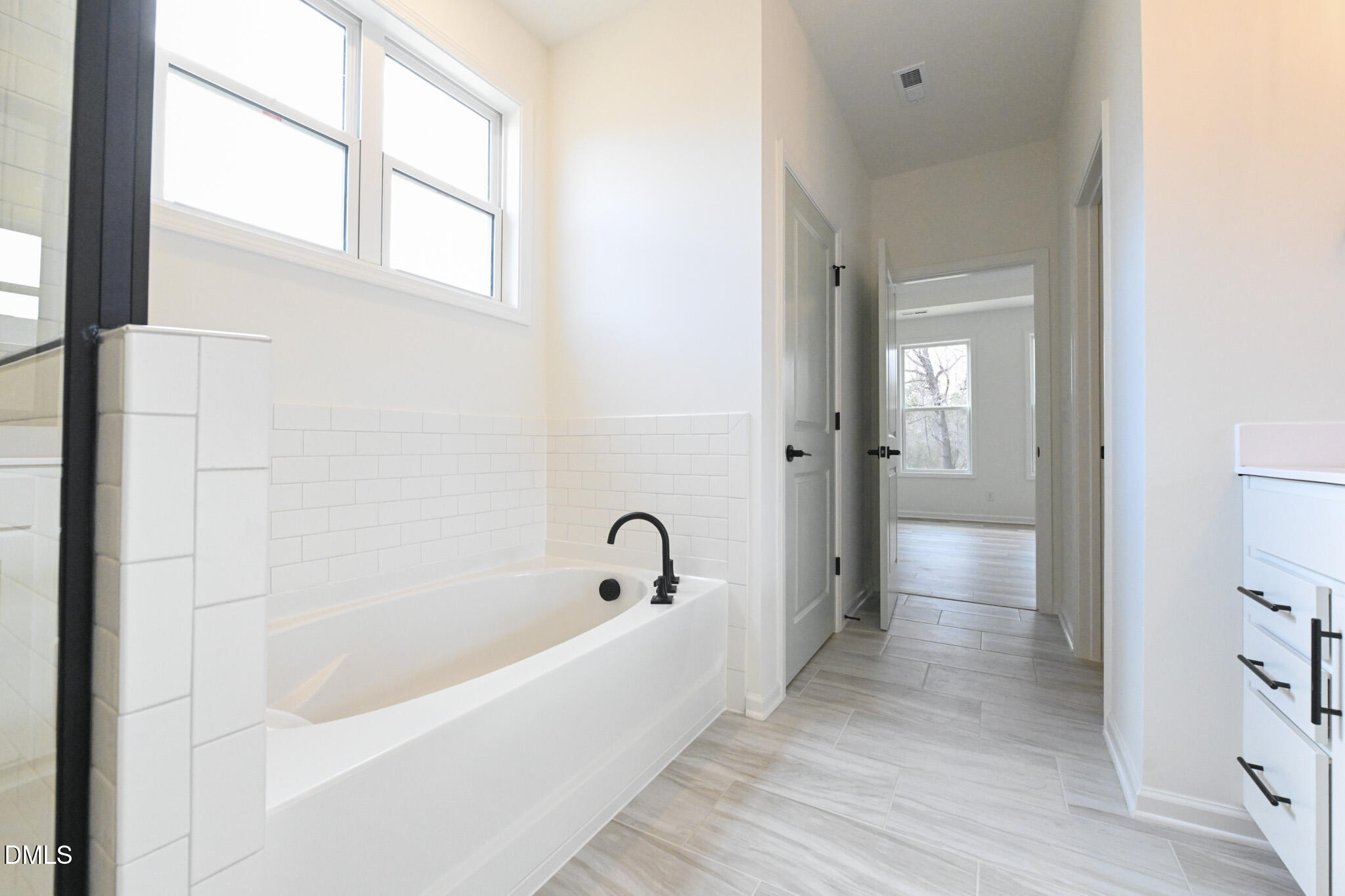 72 South Bream Court Angier, NC 27501 - Photo 29 of 44 a bathroom with a bathtub and shower