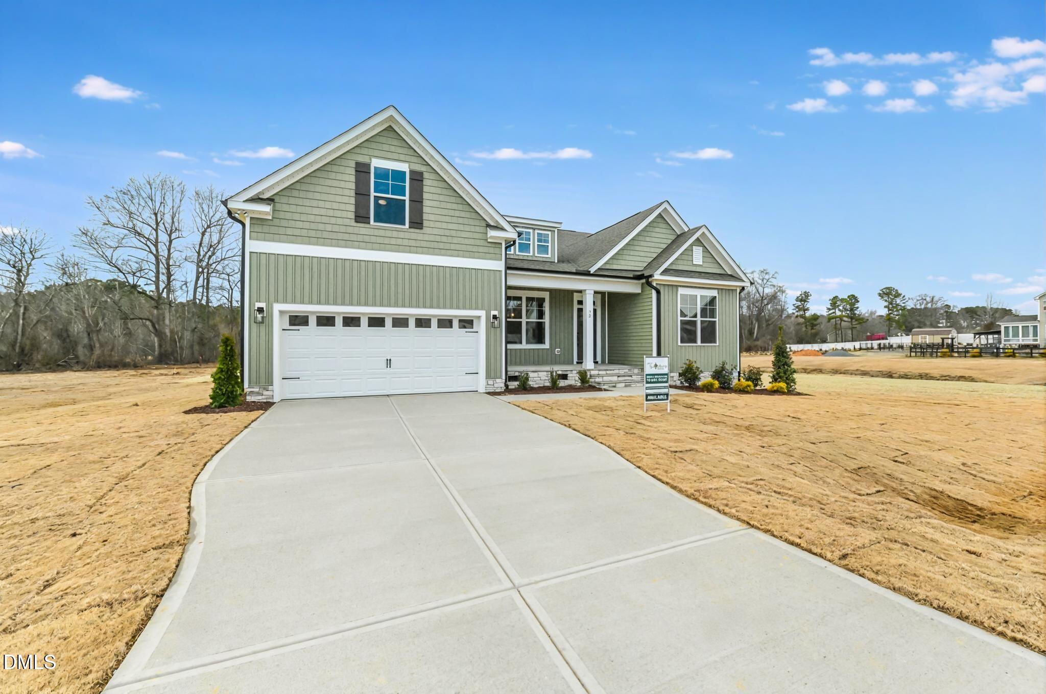 72 South Bream Court Angier, NC 27501 - Photo 3 of 44 a front view of a house with a yard