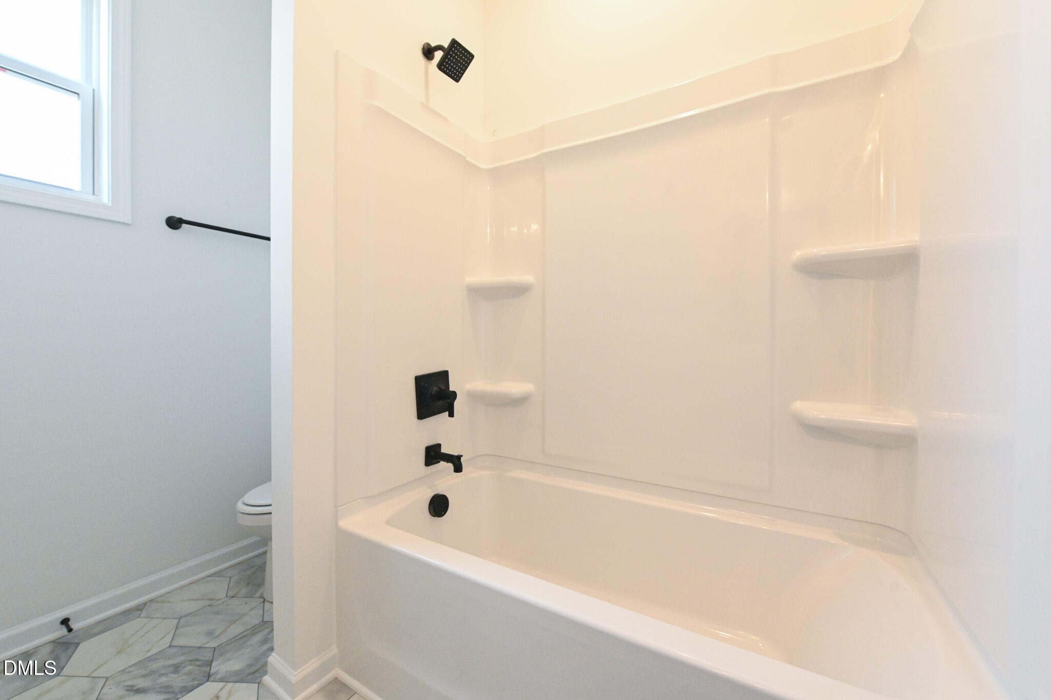 72 South Bream Court Angier, NC 27501 - Photo 34 of 44 a bathroom with a bathtub and shower