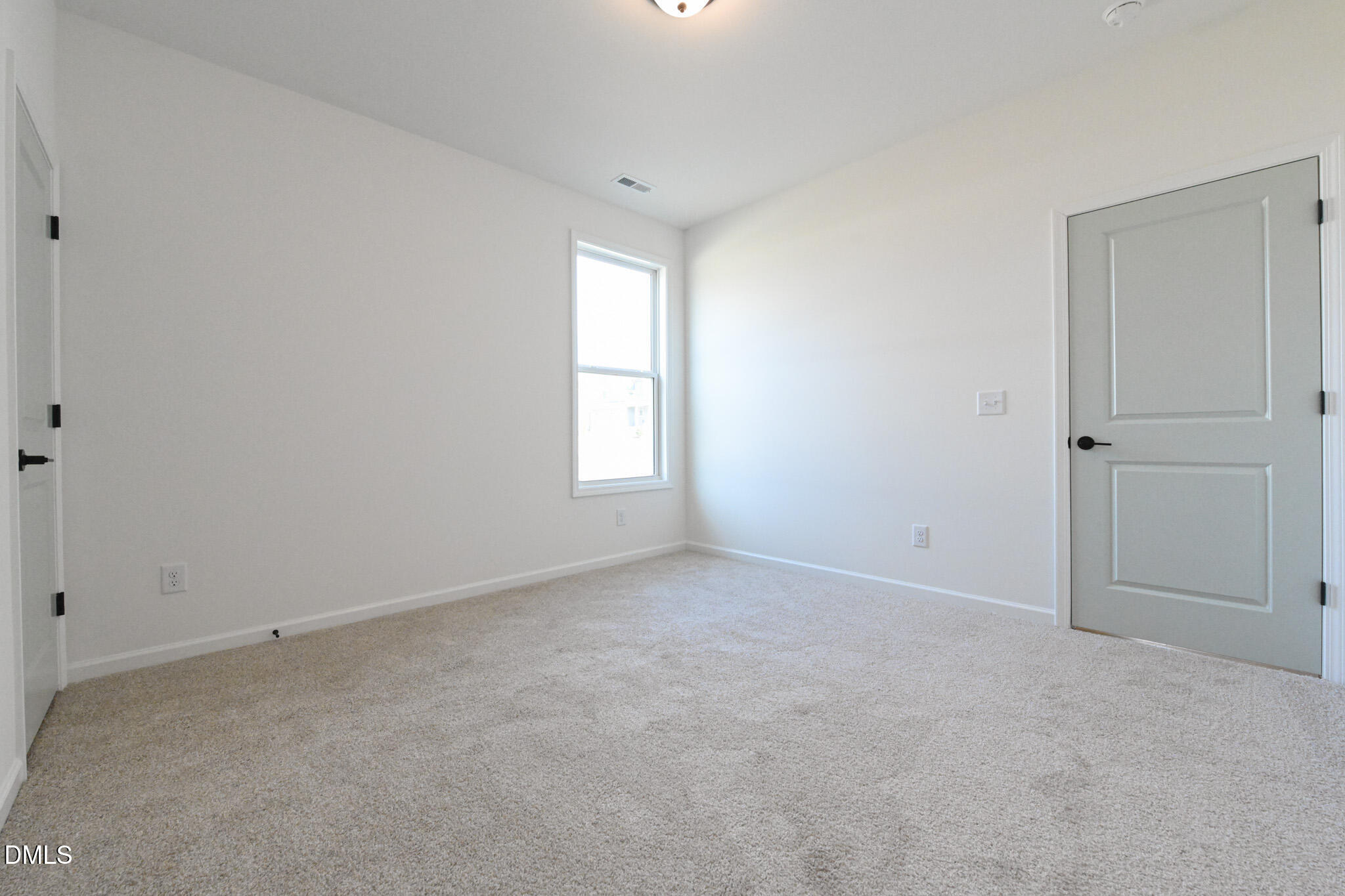 72 South Bream Court Angier, NC 27501 - Photo 35 of 44 an empty room with windows and closet