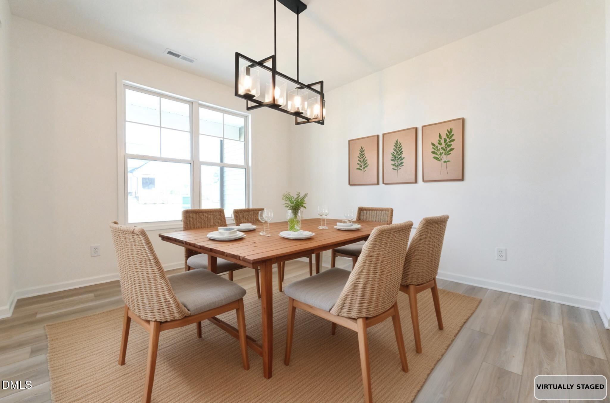 72 South Bream Court Angier, NC 27501 - Photo 6 of 44 a view of a dining room with a table and chairs