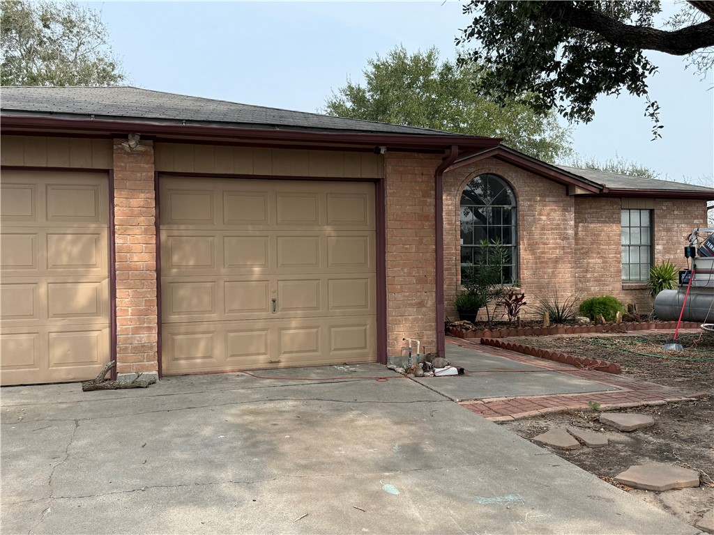 902 St Timothy Street Corpus Christi, TX 78418 - Photo 1 of 24 a front view of a house with a yard