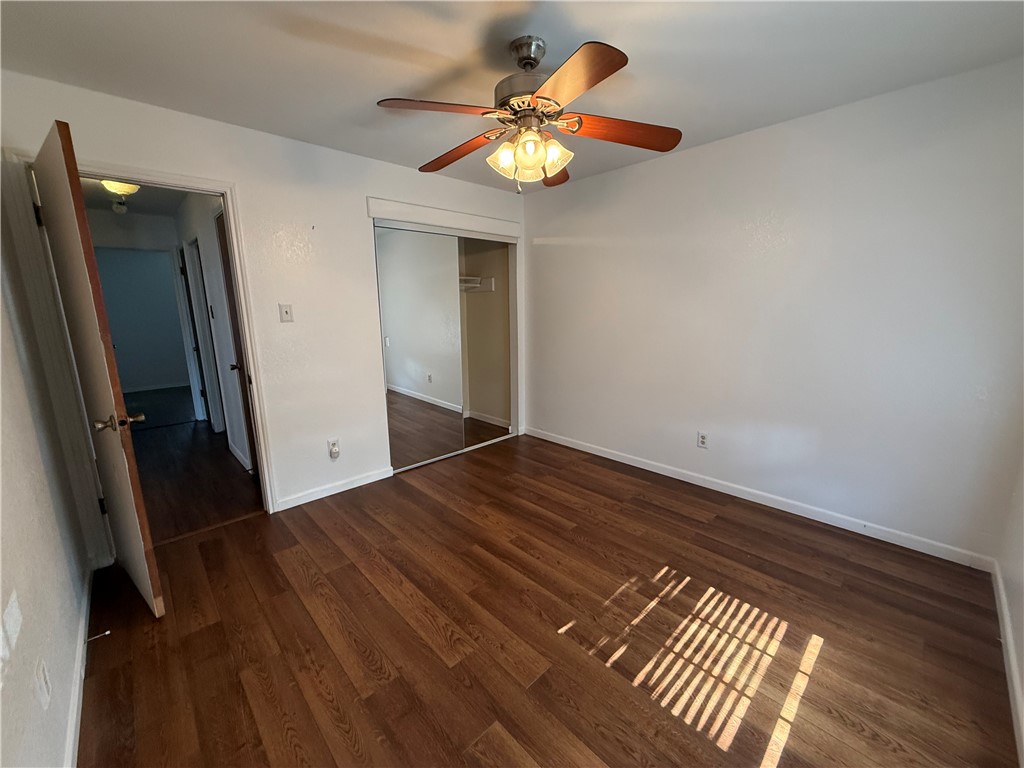 902 St Timothy Street Corpus Christi, TX 78418 - Photo 15 of 24 wooden floor in an empty room with a window