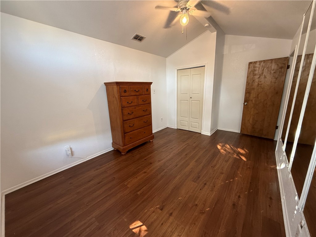 902 St Timothy Street Corpus Christi, TX 78418 - Photo 17 of 24 wooden floor in an empty room with a window