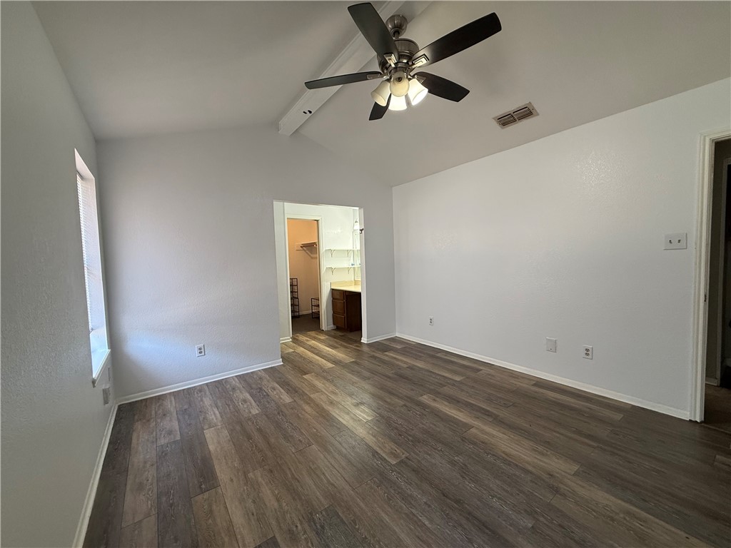 902 St Timothy Street Corpus Christi, TX 78418 - Photo 19 of 24 an empty room with wooden floor and windows