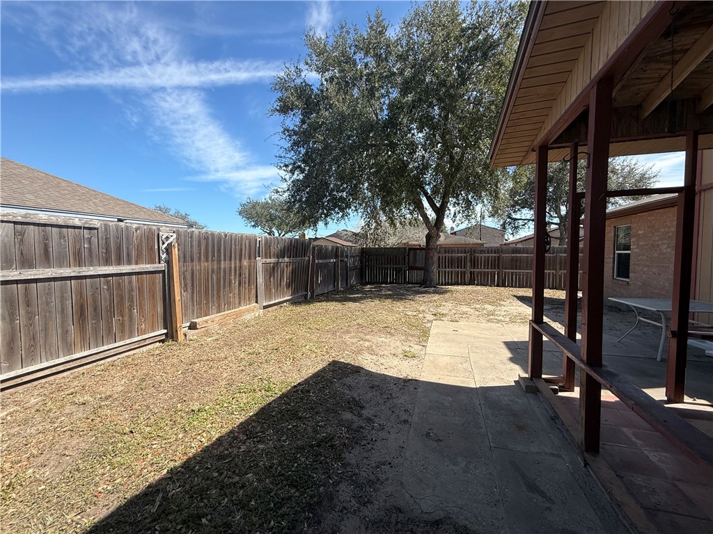 902 St Timothy Street Corpus Christi, TX 78418 - Photo 22 of 24 a view of backyard with wooden fence
