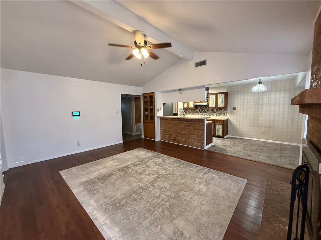 902 St Timothy Street Corpus Christi, TX 78418 - Photo 5 of 24 a view of kitchen and empty room with wooden floor