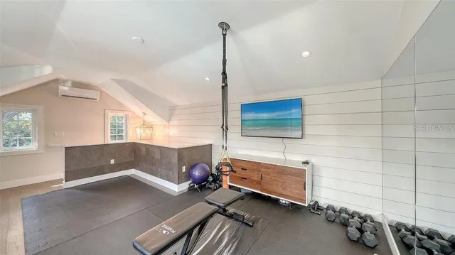 a bedroom with a bed and a table in it