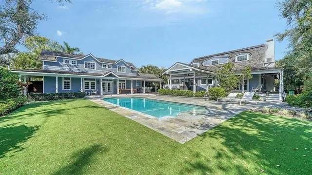 a view of a patio with table and chairs and wooden floor