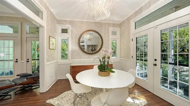 a view of a dining room with furniture window and wooden floor