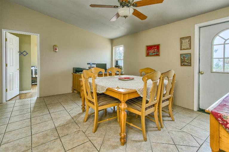 2388 Old Military Road Central Point, OR 97502 - Photo 23 of 35 a view of a dining room with furniture and chandelier fan