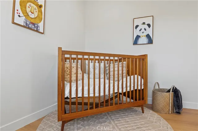 a kitchen with a sink a stove a refrigerator and white cabinets