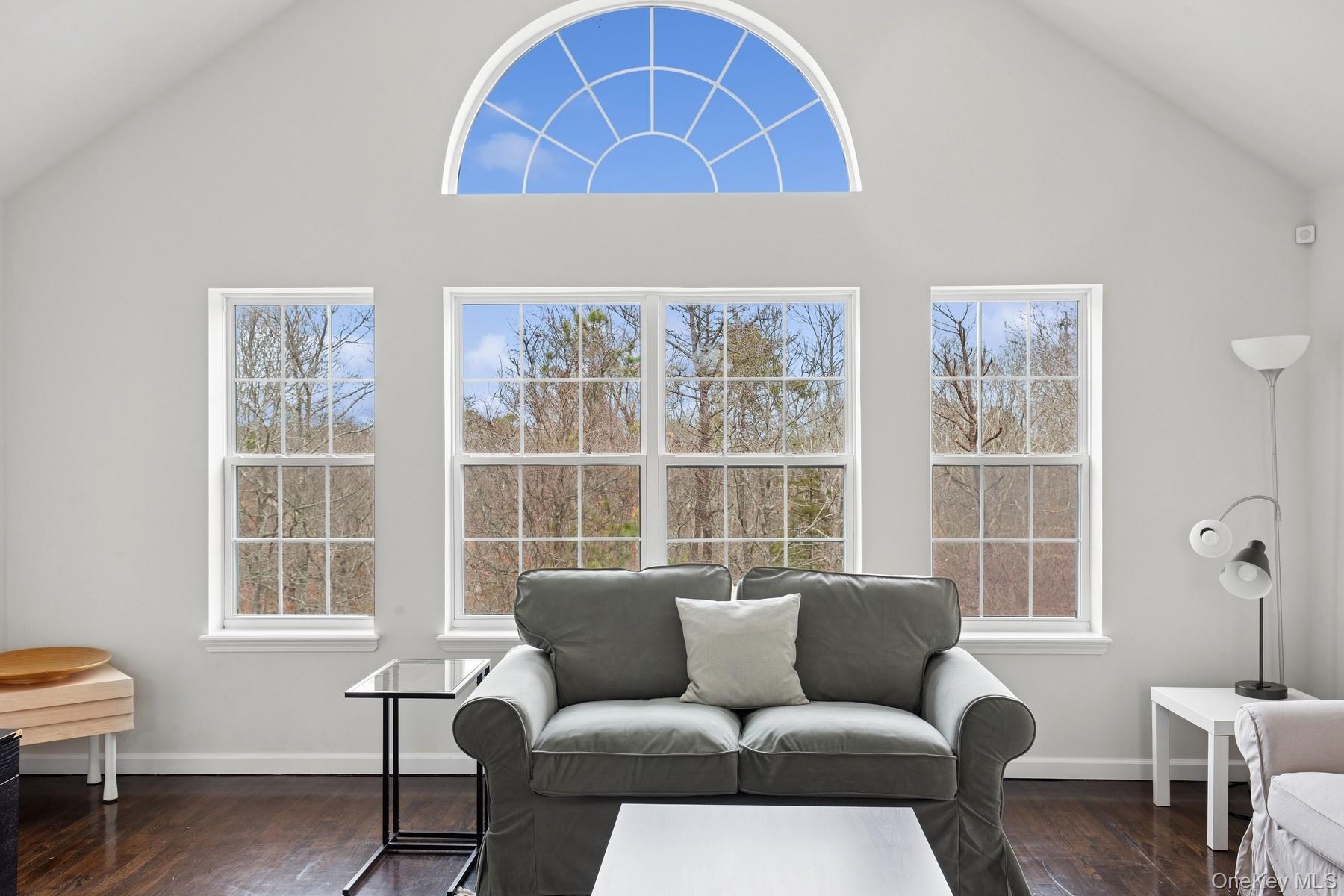 71 Old Canoe Place Road Hampton Bays, NY 11946 - Photo 23 of 34 a living room with furniture and a window