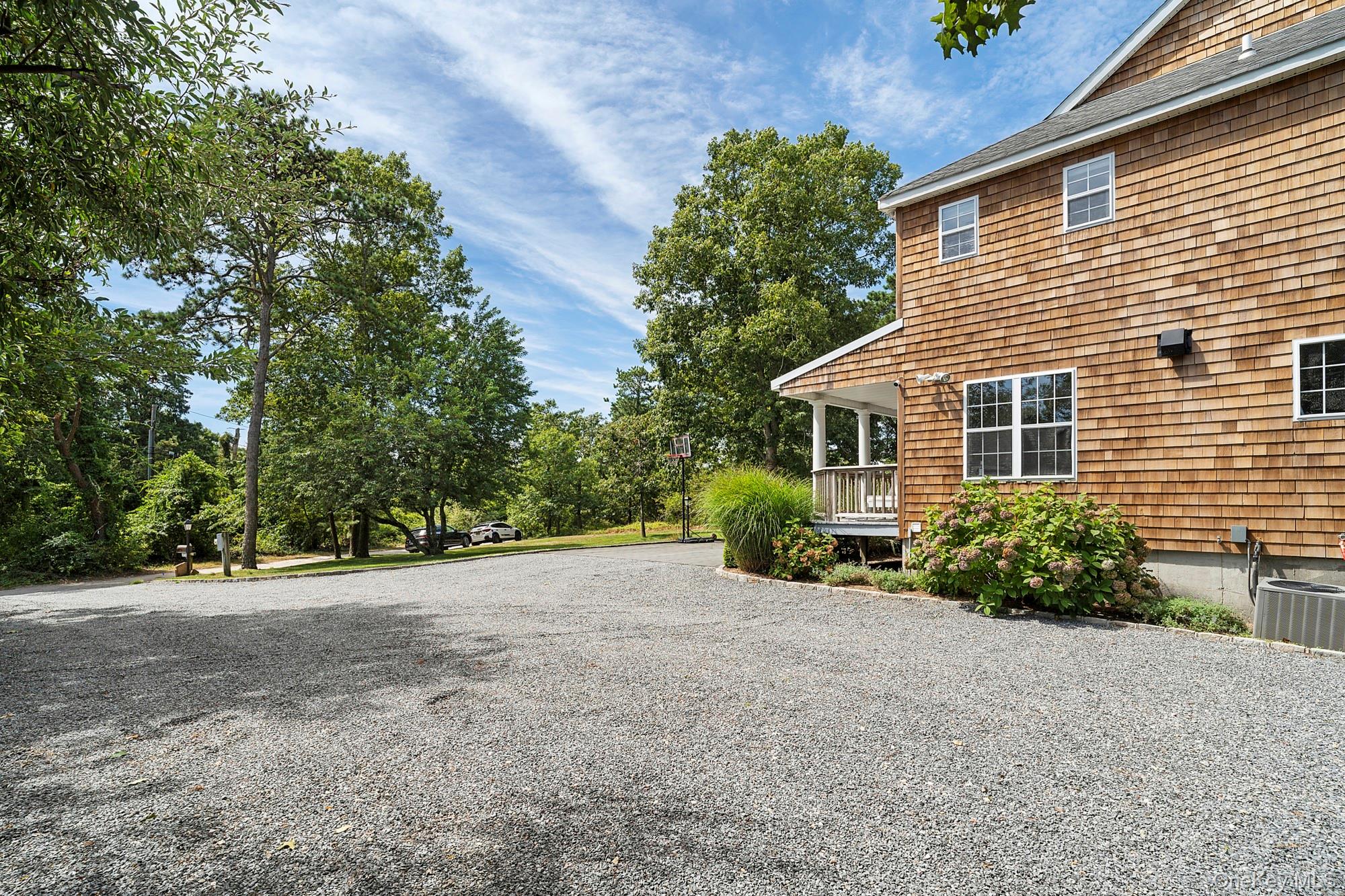 71 Old Canoe Place Road Hampton Bays, NY 11946 - Photo 4 of 34 a view of a house with a outdoor space
