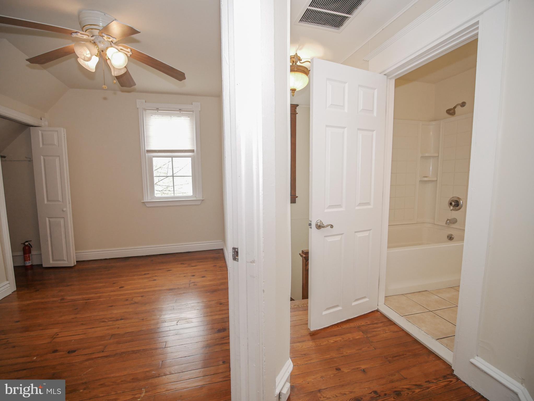 332 Crown Point Road Thorofare, NJ 08086 - Photo 35 of 36 wooden floor in an empty room with a window