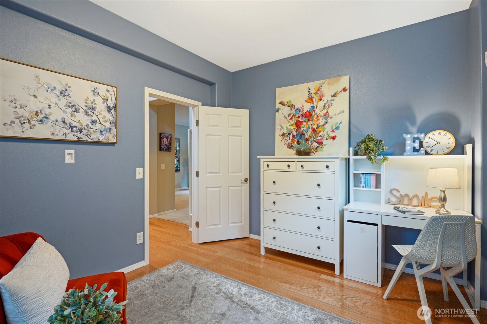 206 Pasco Drive Northeast Renton, WA 98059 - Photo 17 of 40 a view of a workspace with furniture and wooden floor