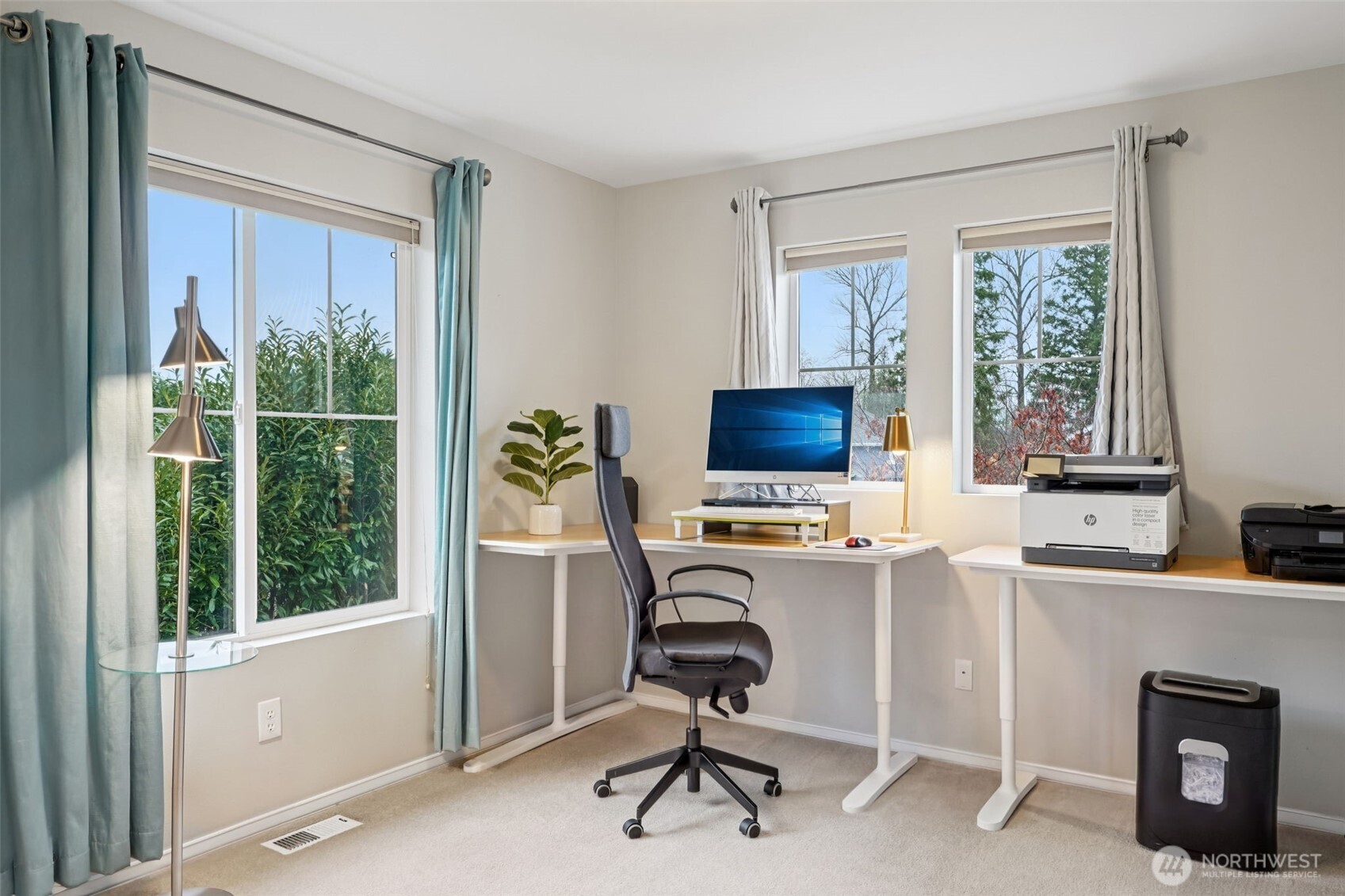 206 Pasco Drive Northeast Renton, WA 98059 - Photo 24 of 40 a view of a workspace with furniture and a window