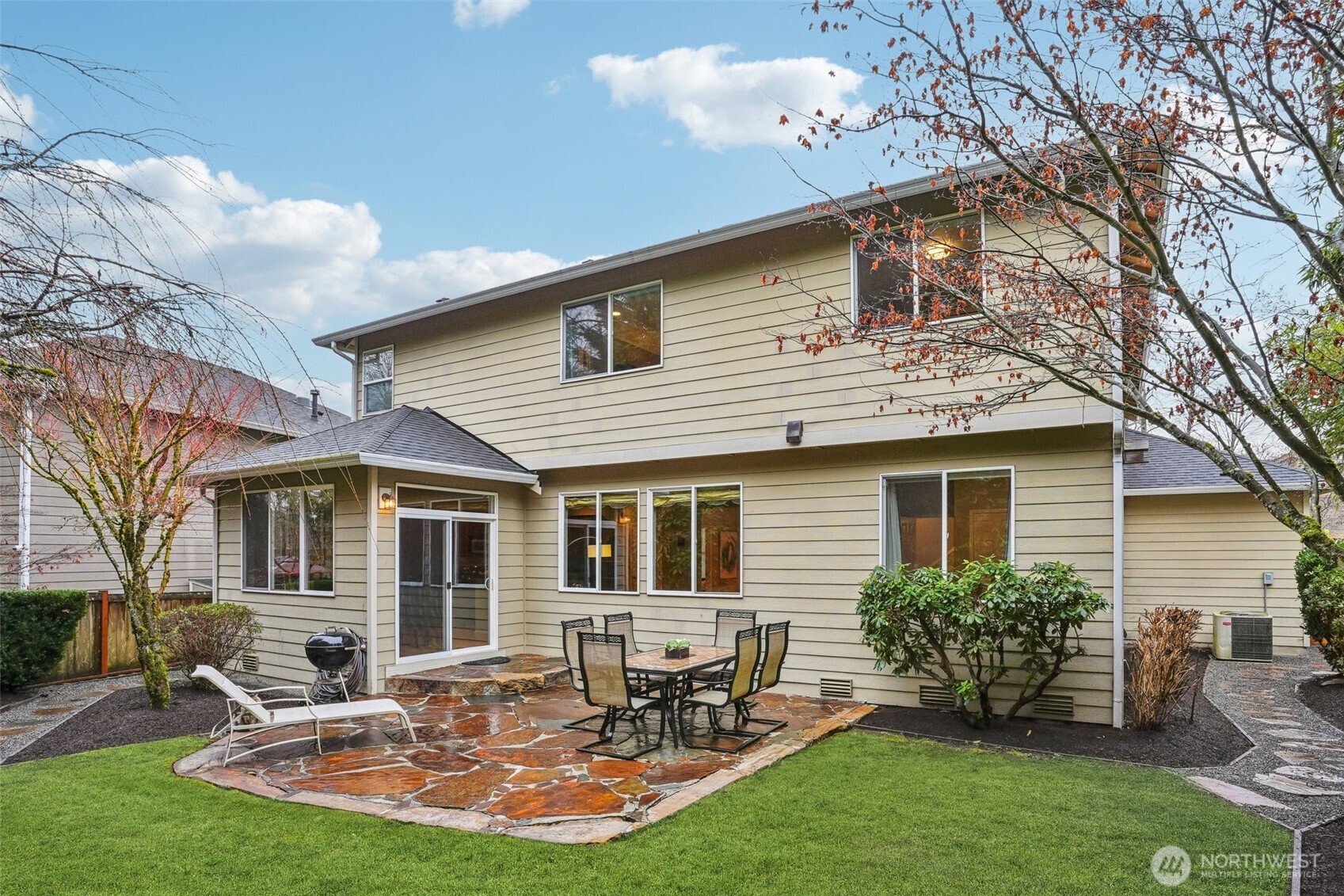 206 Pasco Drive Northeast Renton, WA 98059 - Photo 31 of 40 a view of a house with backyard sitting area and garden