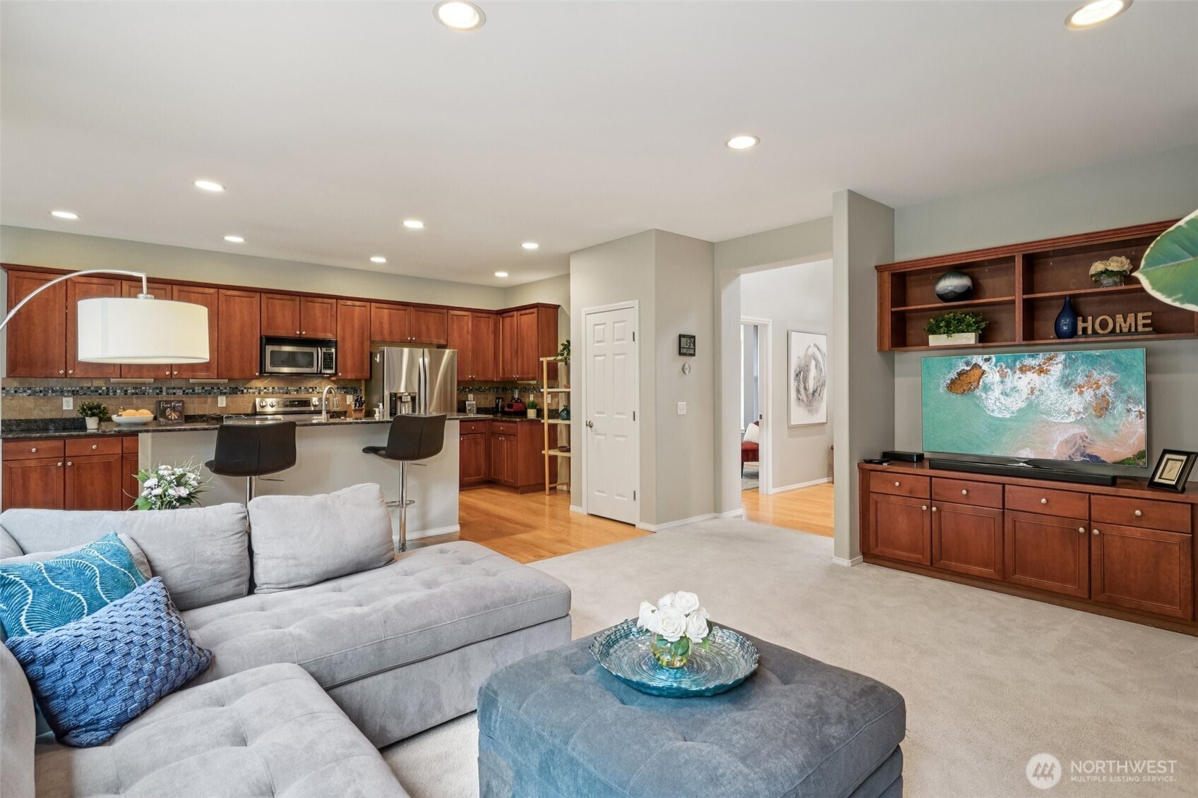 206 Pasco Drive Northeast Renton, WA 98059 - Photo 5 of 40 a living room with stainless steel appliances kitchen island granite countertop a couch and a view of kitchen