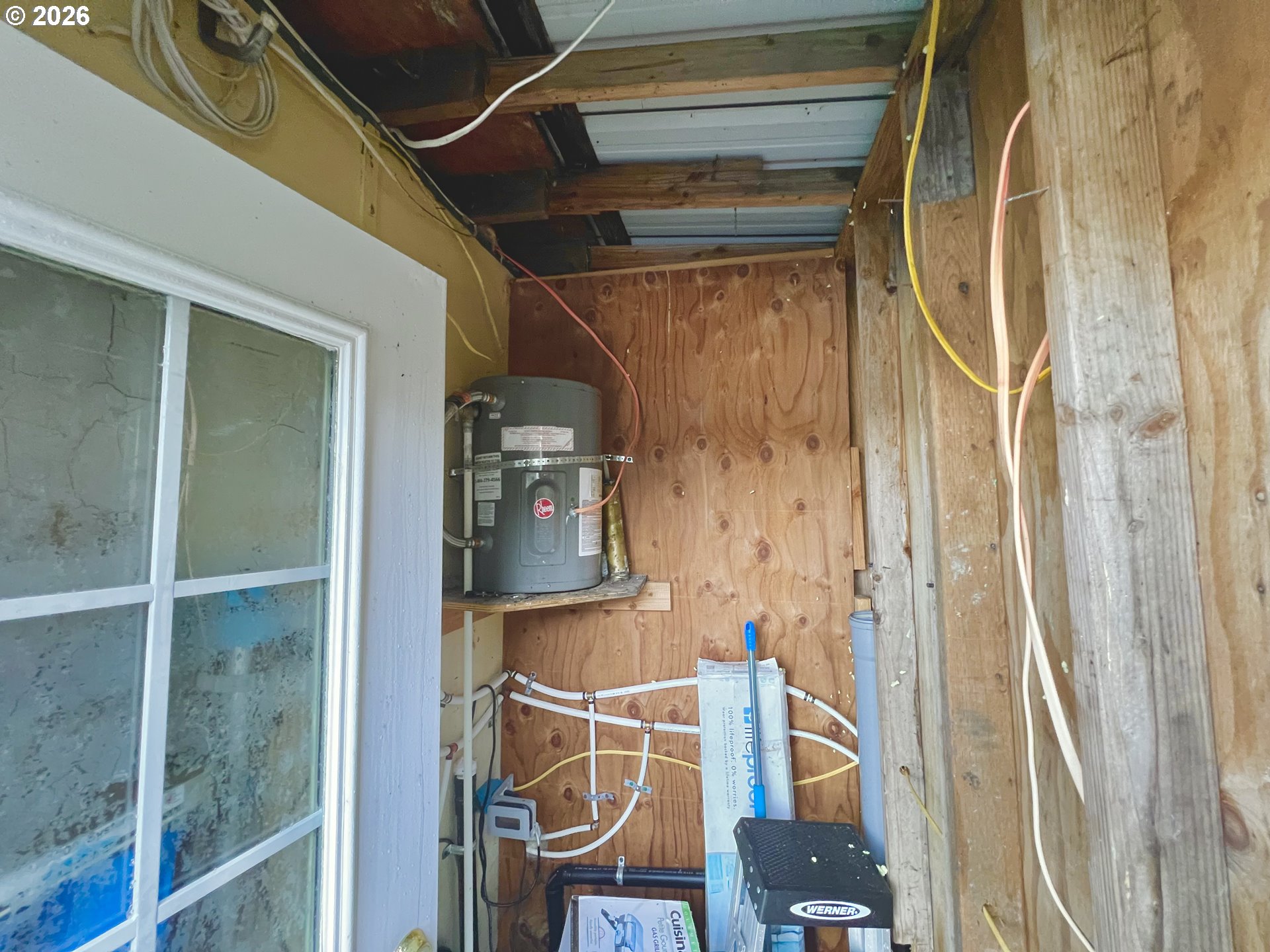 515 North Tenmile Lakeside, OR 97449 - Photo 11 of 20 a room with wooden door