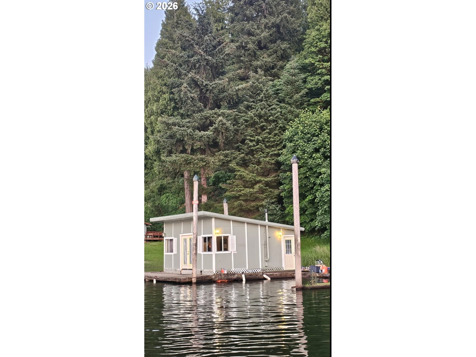 515 North Tenmile Lakeside, OR 97449 - Photo 19 of 20 a view of a house with a small yard