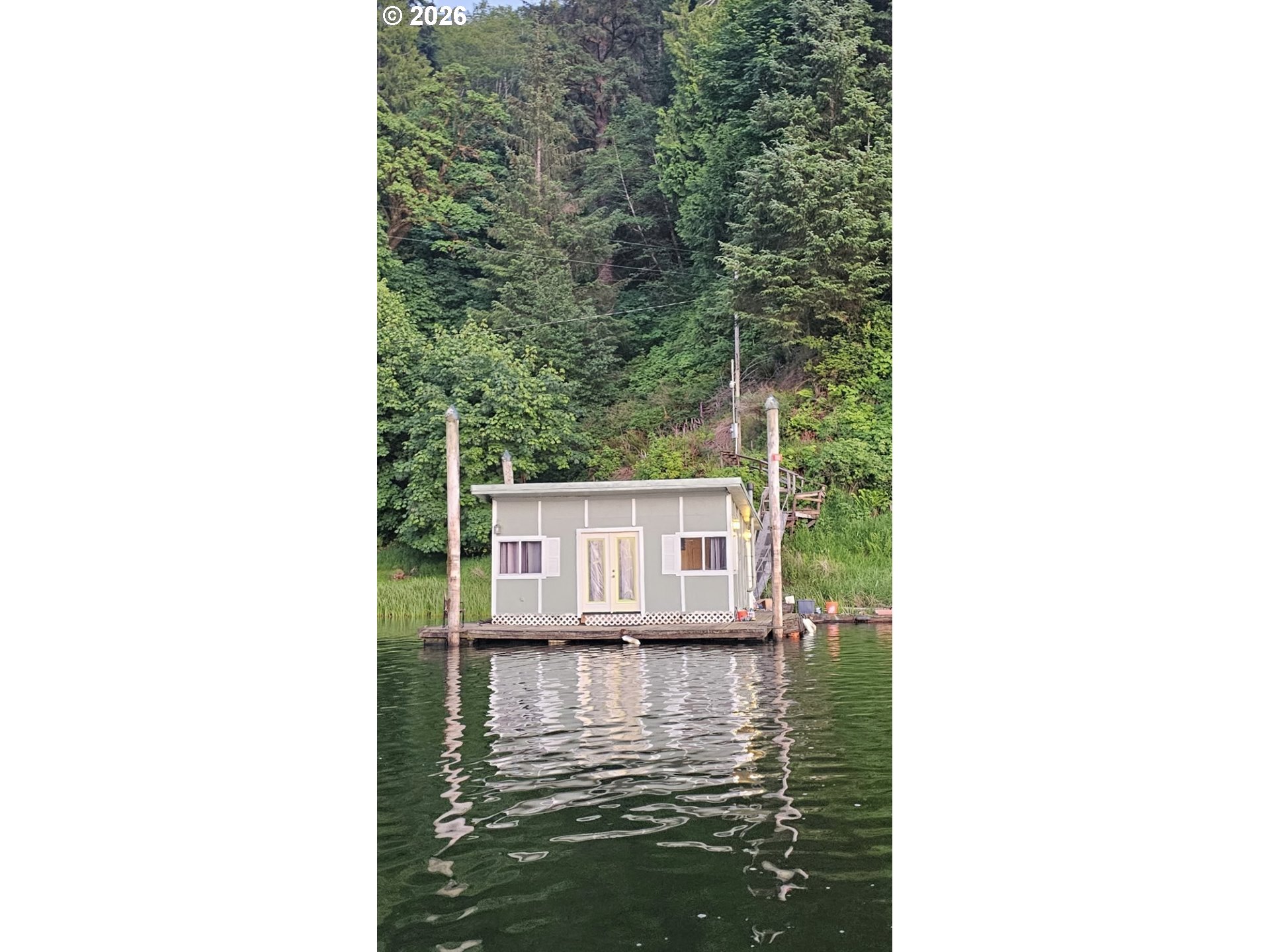 515 North Tenmile Lakeside, OR 97449 - Photo 20 of 20 a view of a house with a small yard