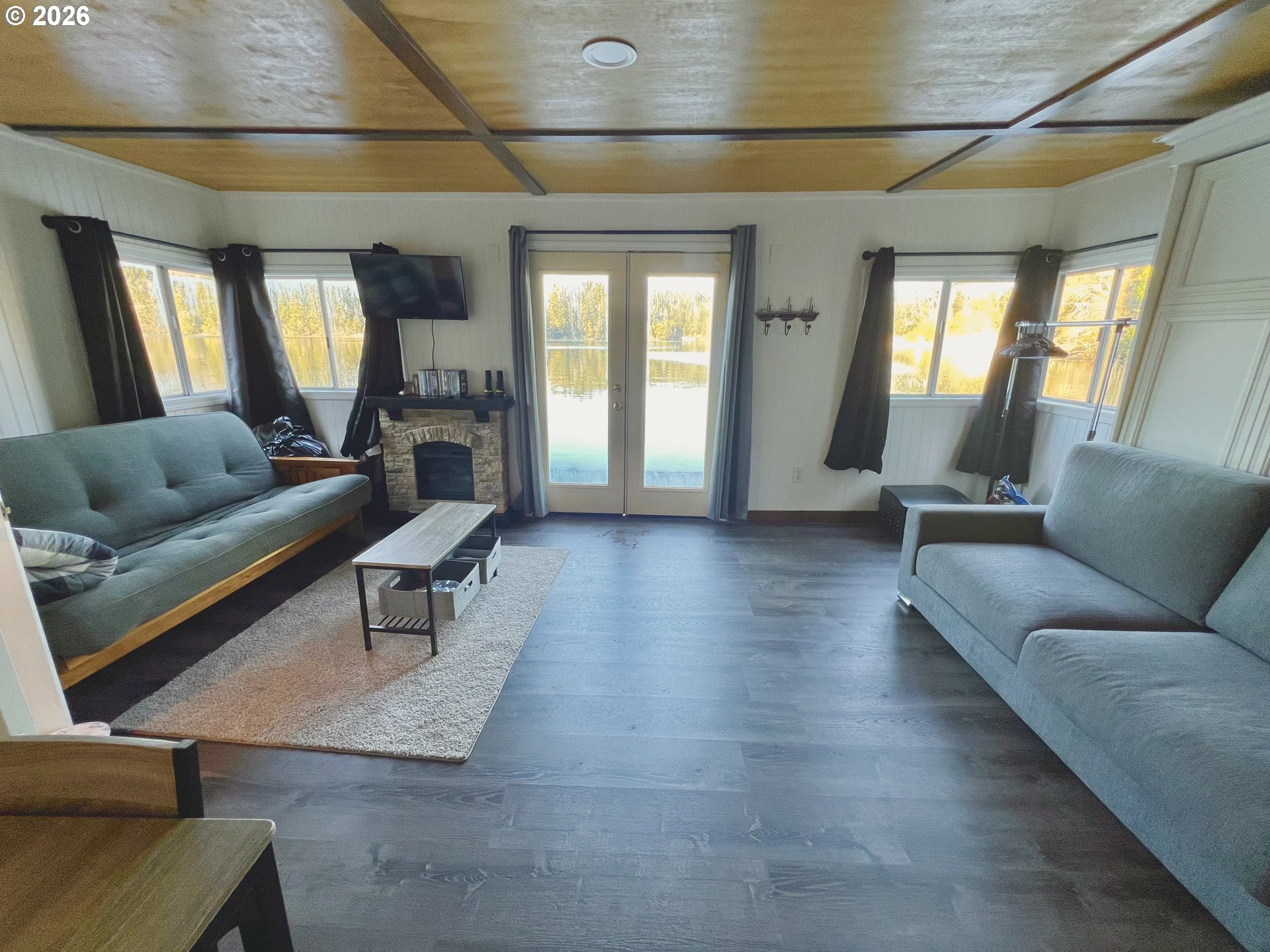 515 North Tenmile Lakeside, OR 97449 - Photo 6 of 20 a living room with furniture and wooden floor