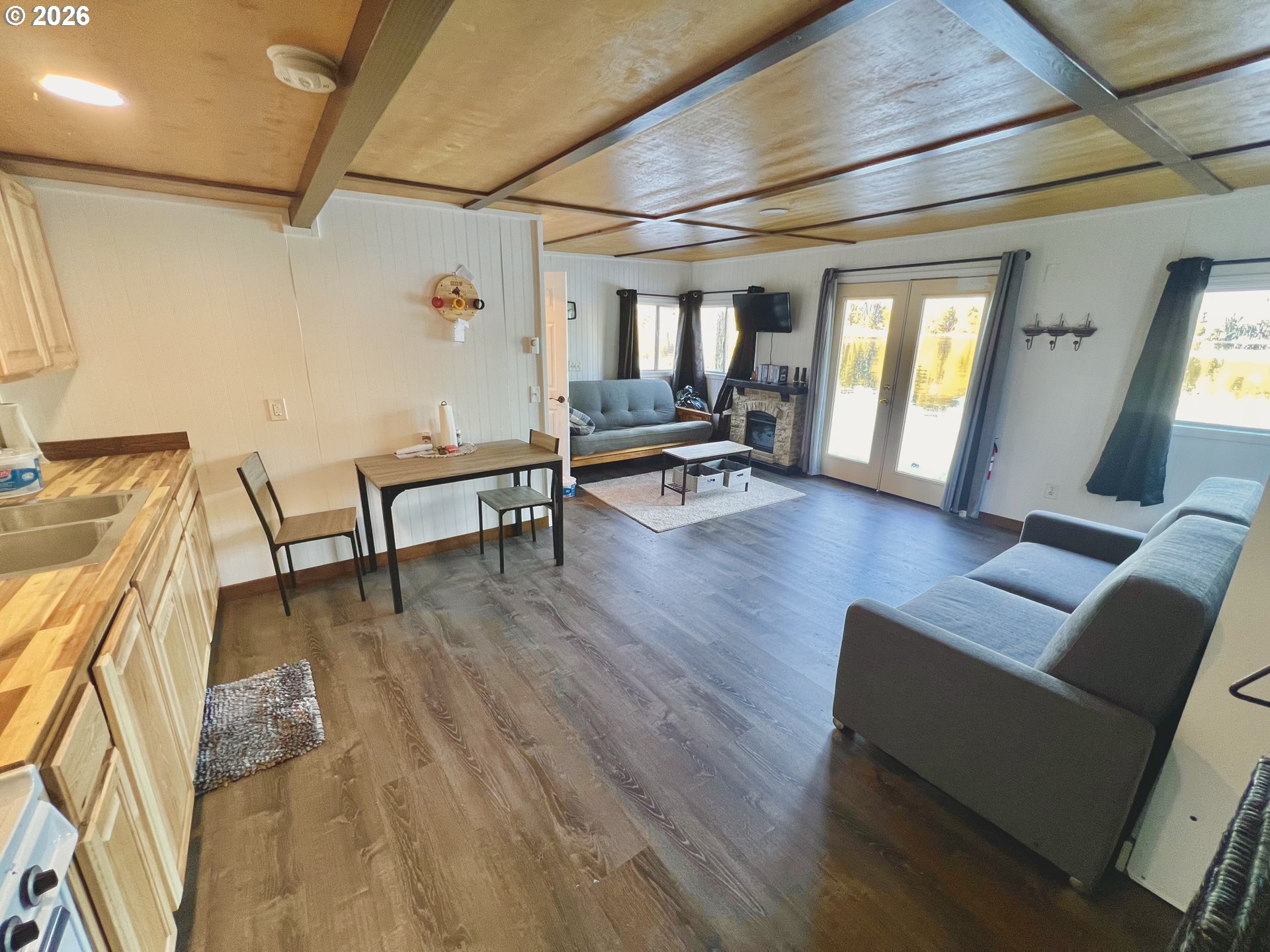 515 North Tenmile Lakeside, OR 97449 - Photo 8 of 20 a living room with furniture and a wooden floor