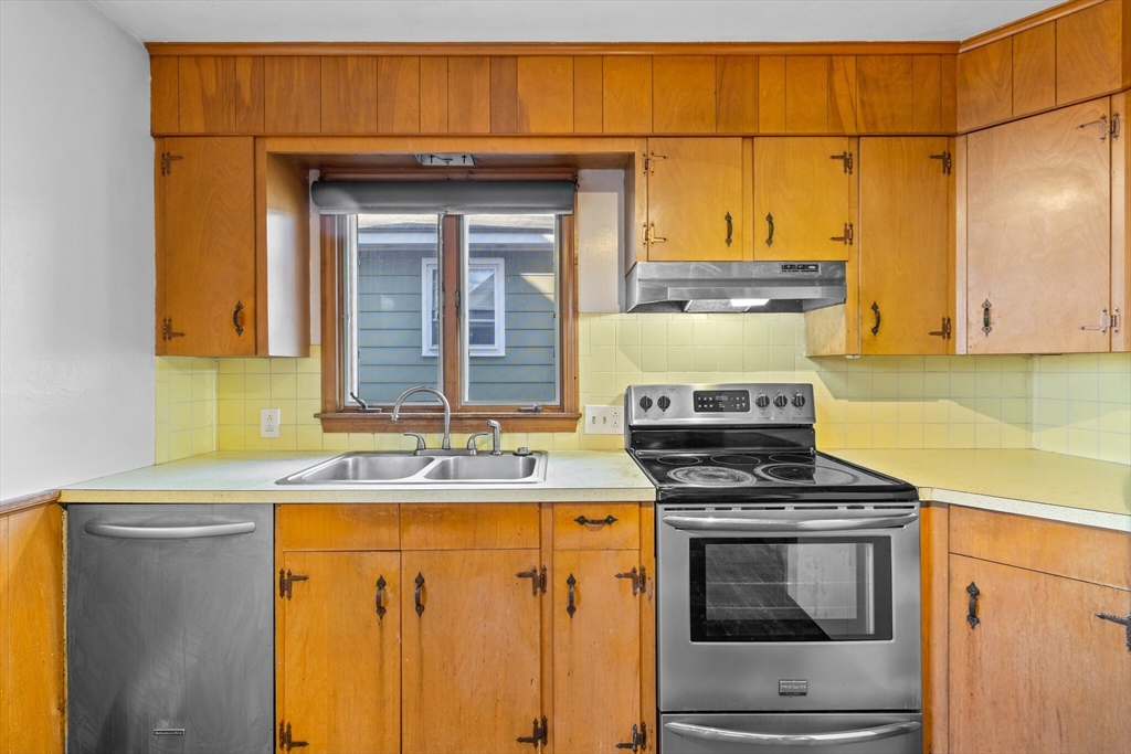 18 Huron Street Springfield, MA 01104 - Photo 10 of 35 a kitchen with a stove and a sink