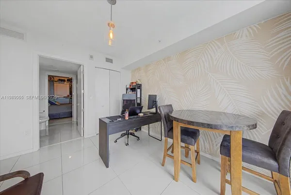 a workspace with furniture and white walls