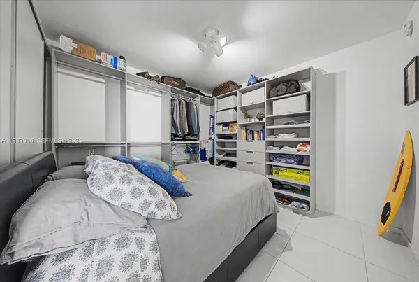 a bedroom with a bed and a walk in closet