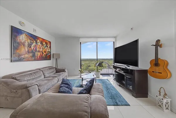 a living room with furniture and a flat screen tv