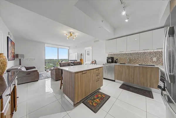 a kitchen with sink cabinets and window