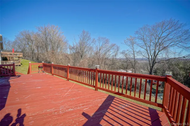 a view of a balcony with trees