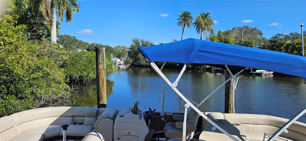 Tennessee Avenue Palm Harbor, FL 34683 - Photo 5 of 10 a backyard of a house with table and chairs
