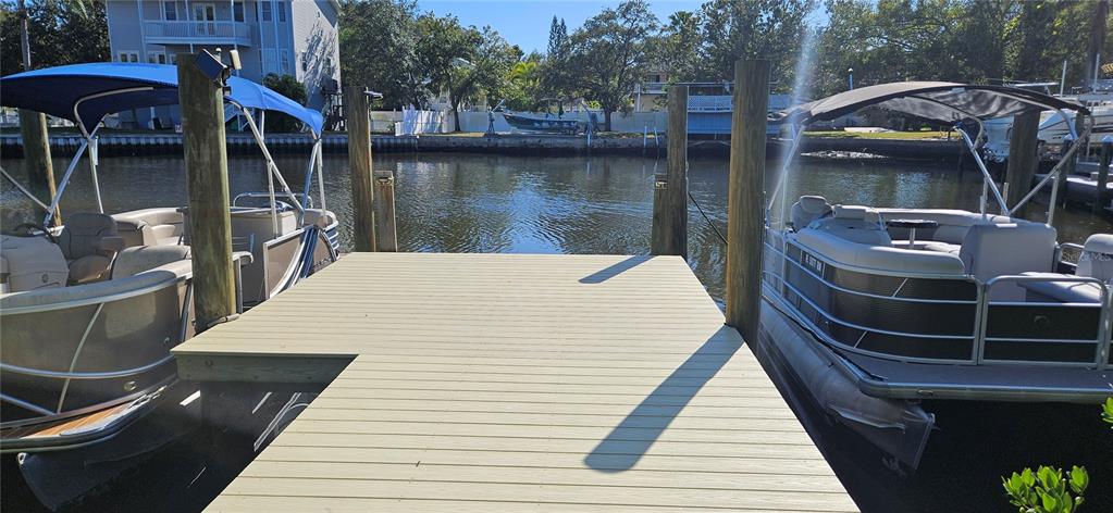 Tennessee Avenue Palm Harbor, FL 34683 - Photo 9 of 10 a view of a wooden deck with furniture