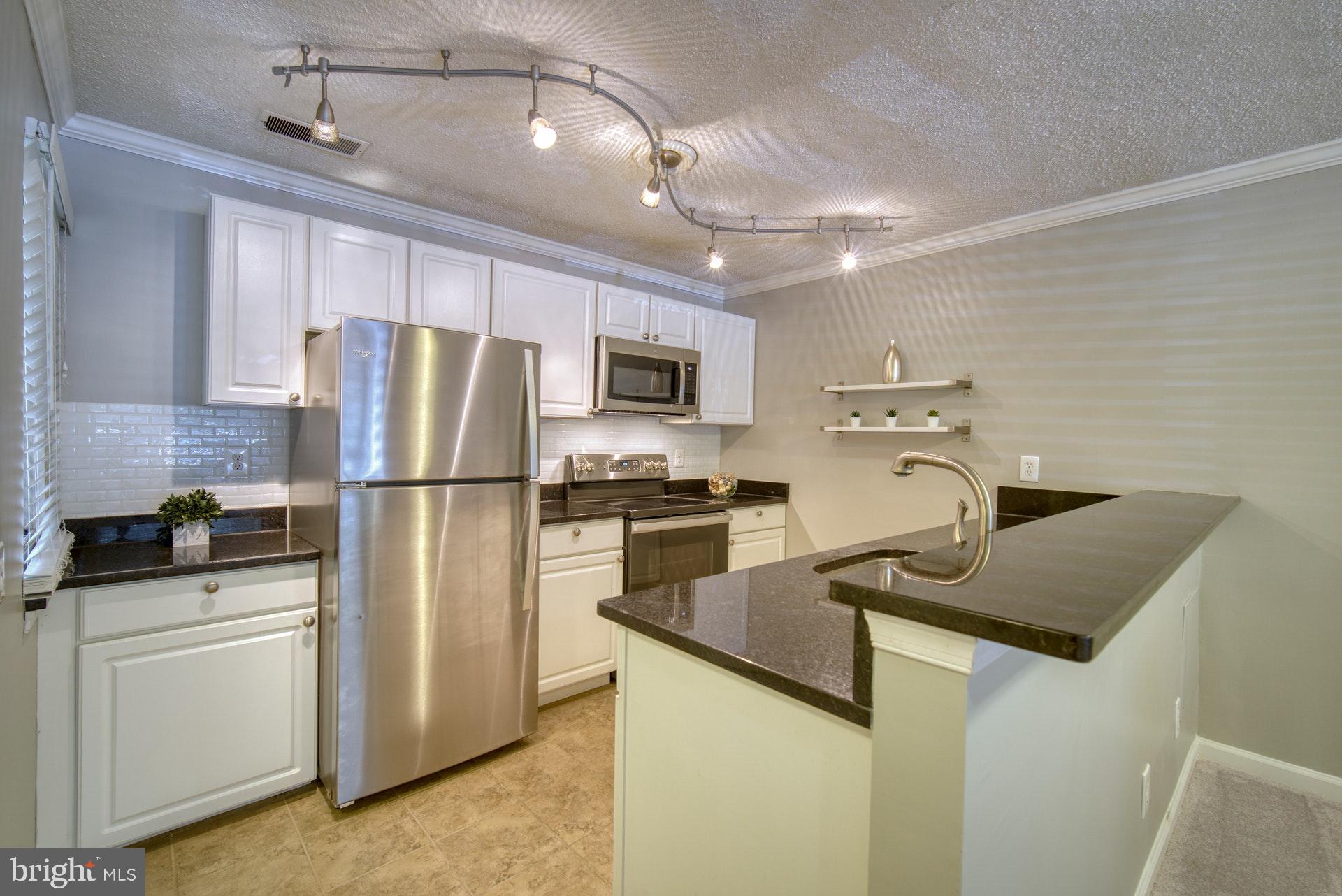 1638 Westwind Way McLean, VA 22102 - Photo 7 of 25 Bar area open to the dining & living areas