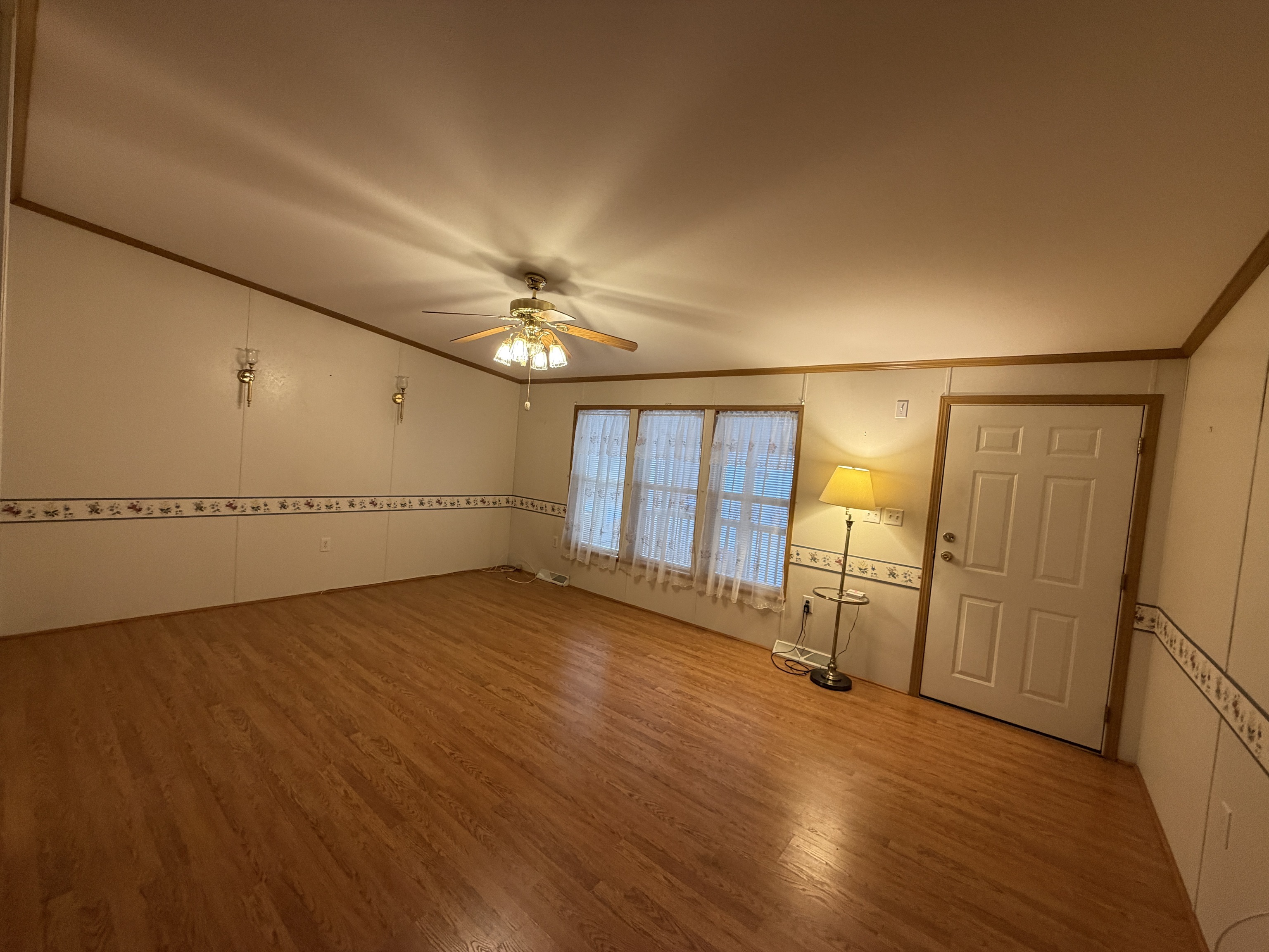 16 3rd Street Beacon Falls, CT 06403 - Photo 6 of 12 an empty room with wooden floor and chandelier