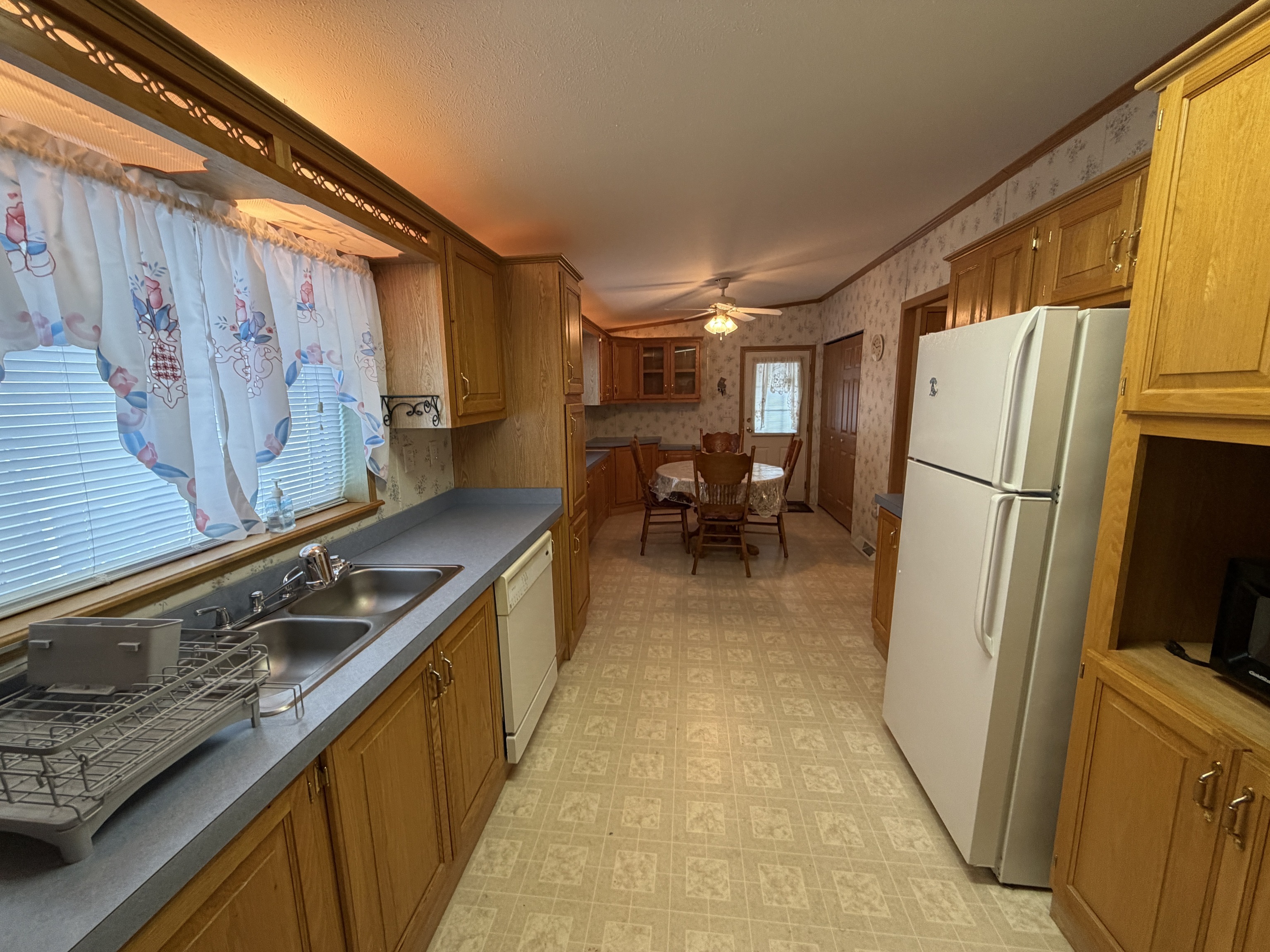 16 3rd Street Beacon Falls, CT 06403 - Photo 9 of 12 a kitchen with a sink a refrigerator and a stove