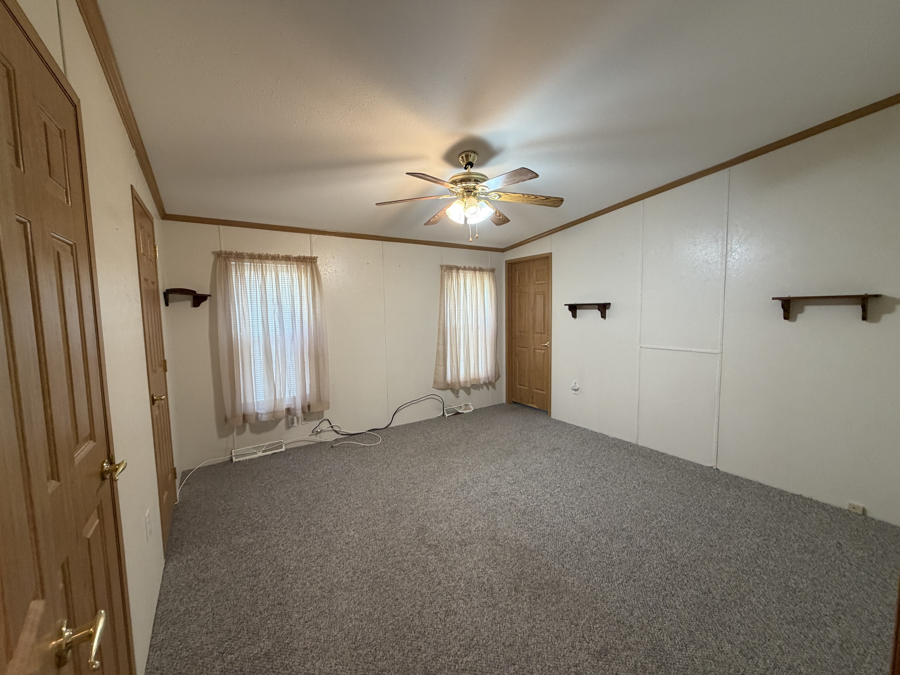 16 3rd Street Beacon Falls, CT 06403 - Photo 10 of 12 an empty room with windows and fan