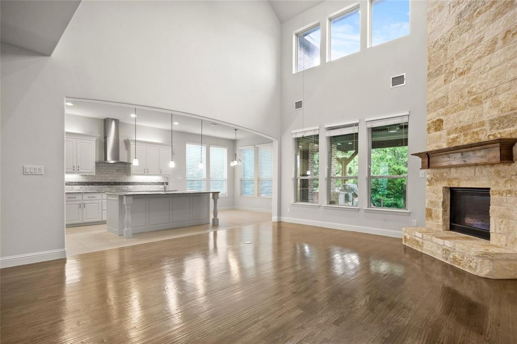 13606 Crianza Road Frisco, TX 75035 - Photo 12 of 40 a view of an empty room with wooden floor and a window