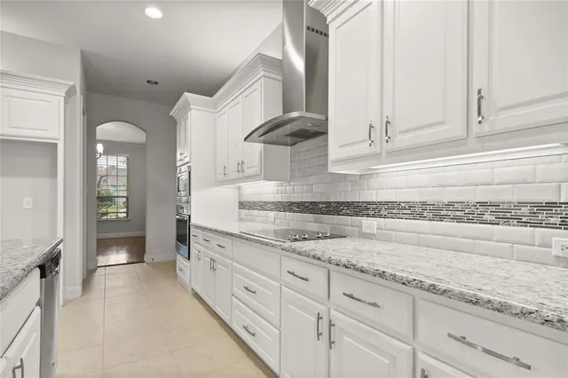 a kitchen with cabinets and appliances