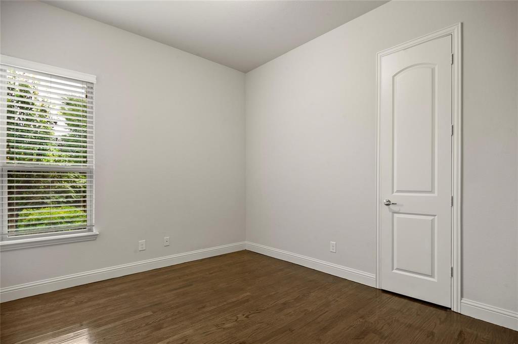 13606 Crianza Road Frisco, TX 75035 - Photo 23 of 40 a view of an empty room with wooden floor and a window