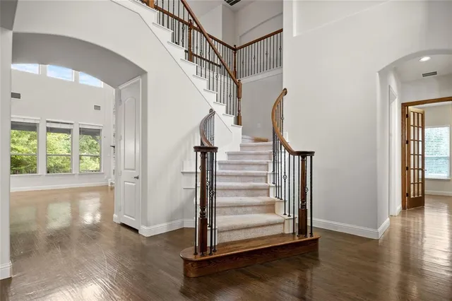 a view of entryway with wooden floor and stairs
