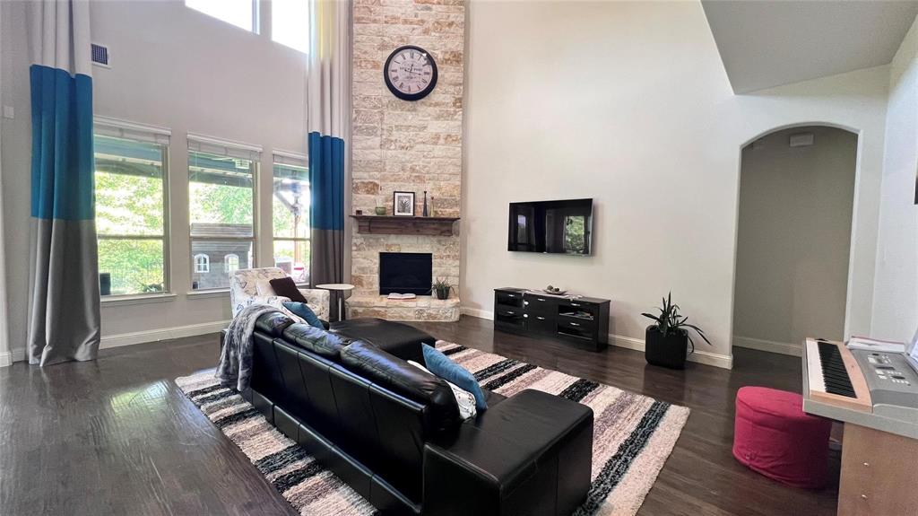 13606 Crianza Road Frisco, TX 75035 - Photo 10 of 40 a living room with furniture fireplace and wooden floor