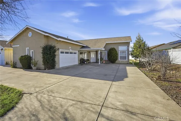a front view of a house with yard