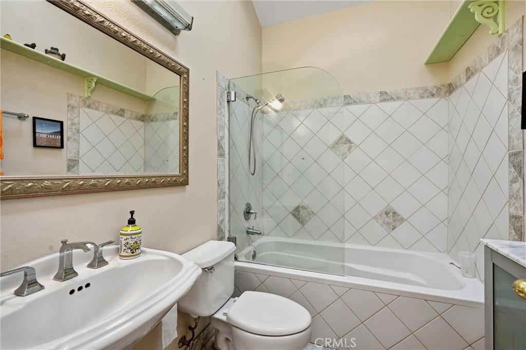 17905 Bunker Road Hidden Valley Lake, CA 95467 - Photo 14 of 28 Hall bathroom has a cheerful skylight and lots of custom tile.