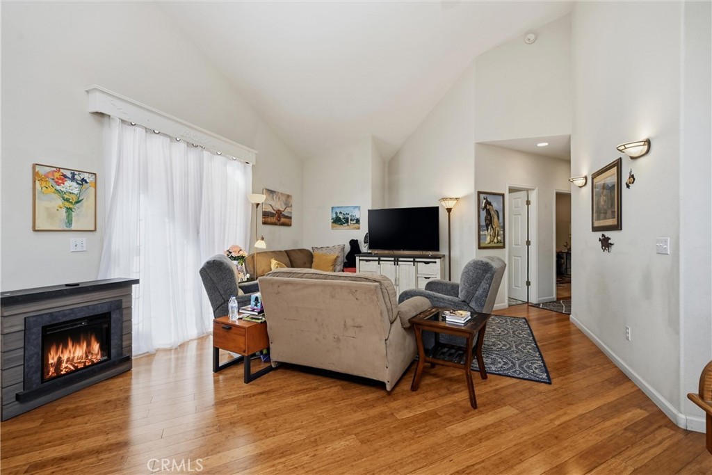 17905 Bunker Road Hidden Valley Lake, CA 95467 - Photo 3 of 28 Living area has lovely bamboo flooring, oversized sliding glass doors and dramatic vaulted ceilings with interesting dynamic angles.