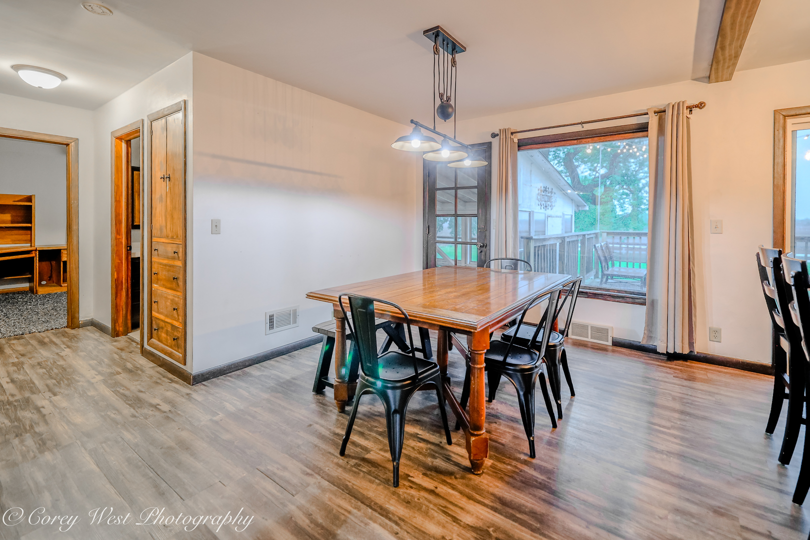 8994 Highway 64 Sycamore, IL 60178 - Photo 10 of 37 a view of a dining room with furniture window and wooden floor